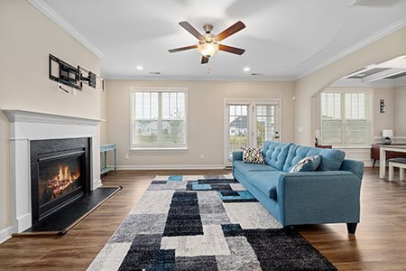 recessed lighting and ceiling fan in a living room